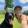 Perry Willett with her black dog Sully